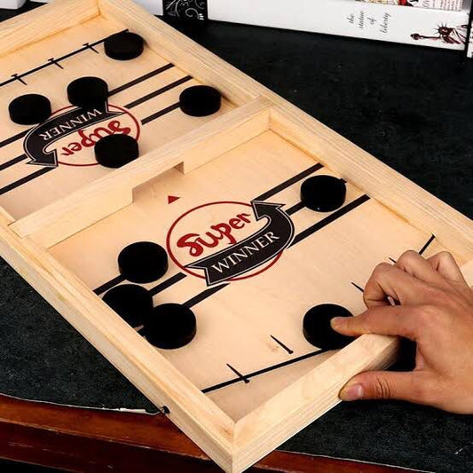 Wooden game board with 'Super Winner' branding, being played on a dark surface.