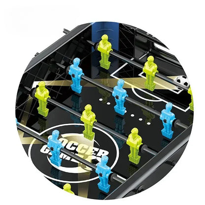 Futbol Mini table football game with green and blue figures on a black base.