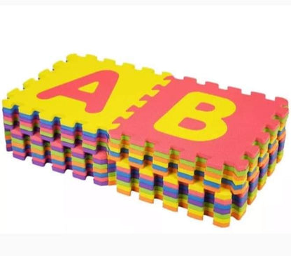 Colorful foam puzzle mats with letters on a white background