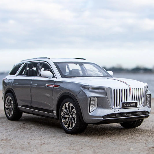 Silver SUV parked on a road with a blurred background