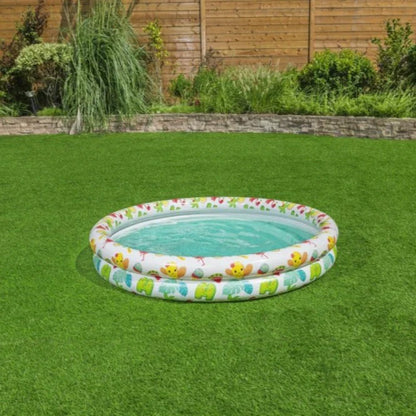 Box of Bestway inflatable pool with children playing on a grassy area