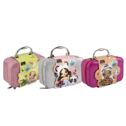Three small suitcases with cartoon character designs on a white background