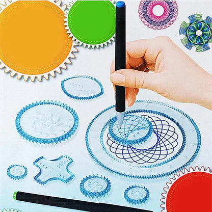 Hand holding a black pen over a drawing mat with geometric designs